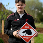 LFC player Milos Kerkez holds up a hedgehog sign